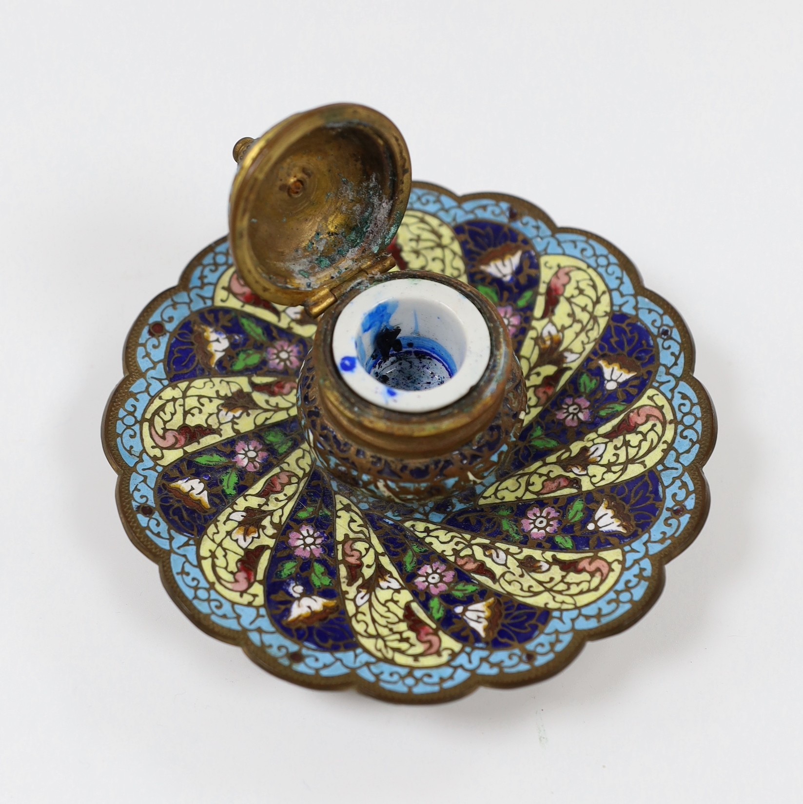 A 19th century French champleve enamel inkstand, 8.5cm tall, a brass snuff boot and two wood snuff boxes